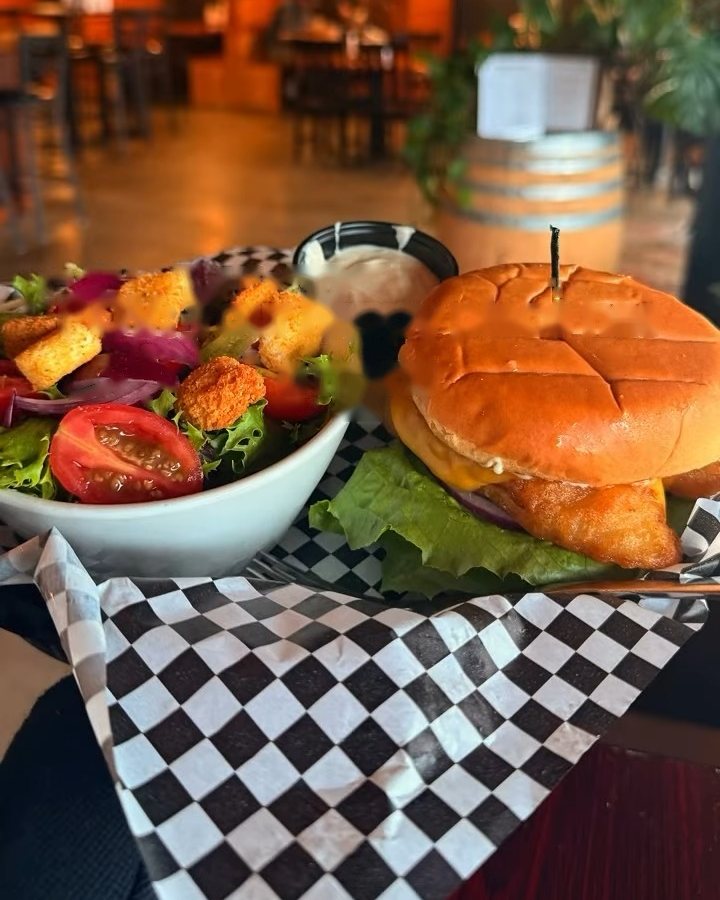 Burger served with a side salad